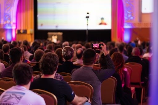 Man taking a photo of Matz's presentation
