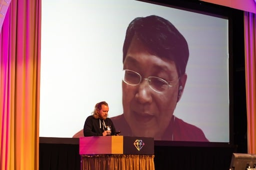 A group of men having a discussion in the foyer