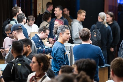 A man with glasses in the foyer