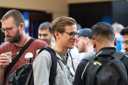 The MC introducting Thijs Cadier. ‘How Music Works’ is up on the screen.