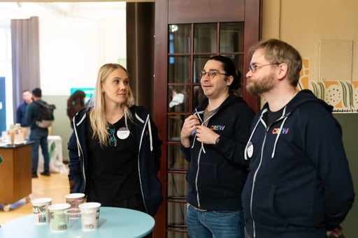 Three crew members having a discussion