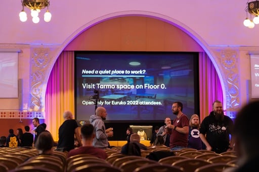 Photo of the break slides with some audience in the foreground