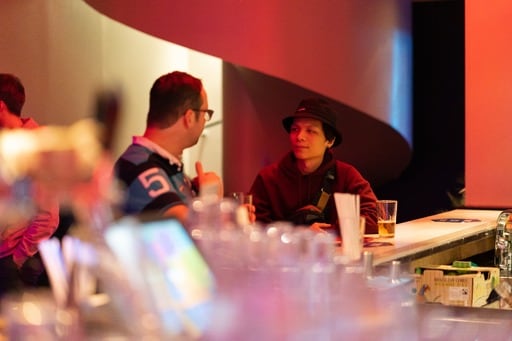 Two men at the bar at the party