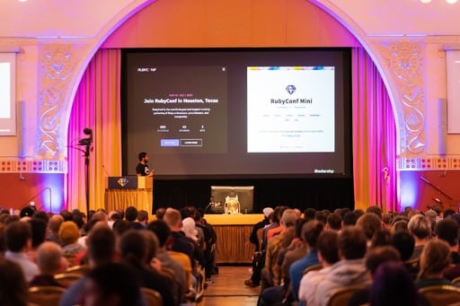 Adarsh Pandit presenting his talk, Ruby Conf Mini on screen