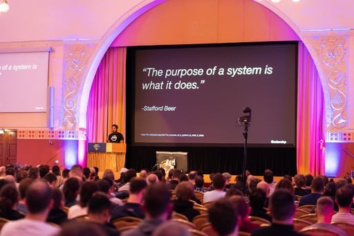 Adarsh Pandit presenting his talk, ‘The purpose of a system is what it does.’ on screen