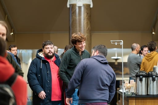 Group of men in the foyer