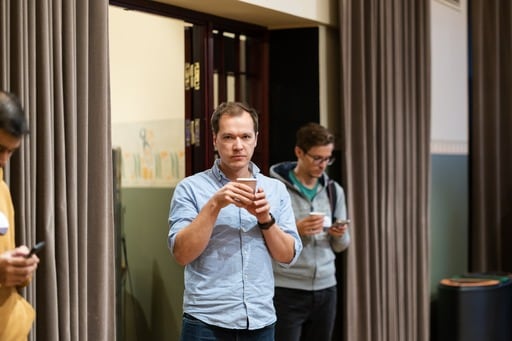 A grumpy man having a coffee