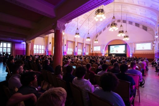 Andy Croll presents his closing keynote, view from the back of the congress hall
